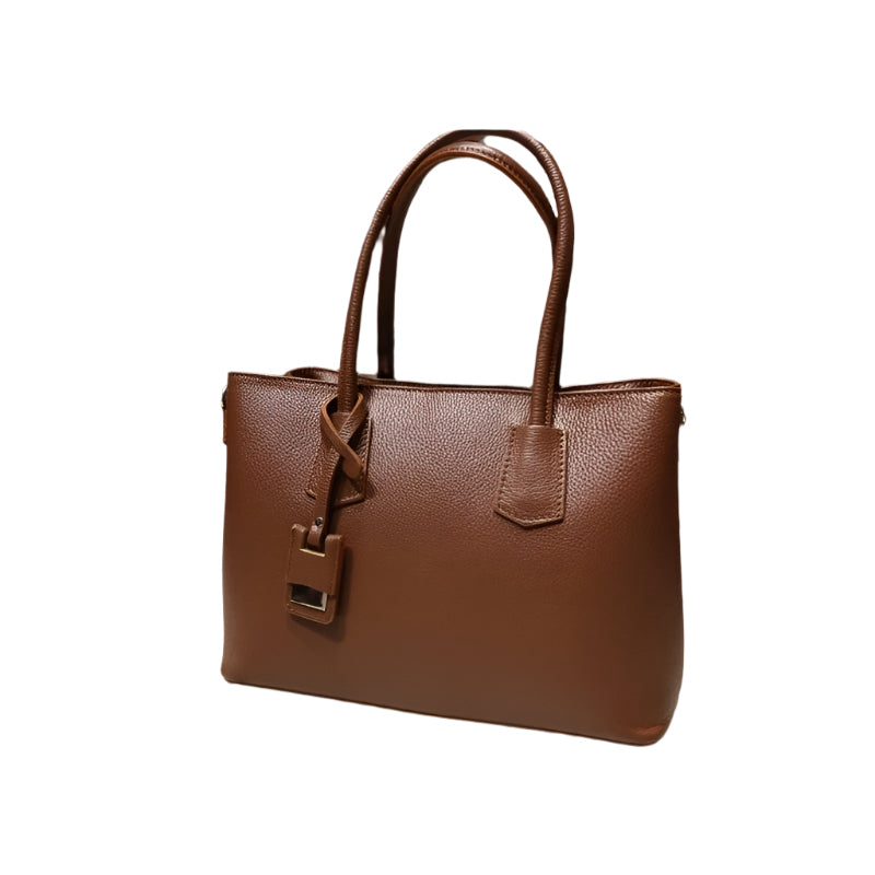 Model carrying Giulia Brown, a chic everyday purse from Numabagstore