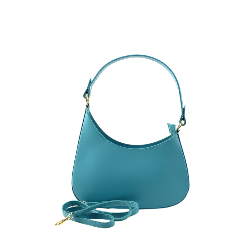 Model carrying Matilda Turquoise, a trendy crossbody bag by Numabagstore