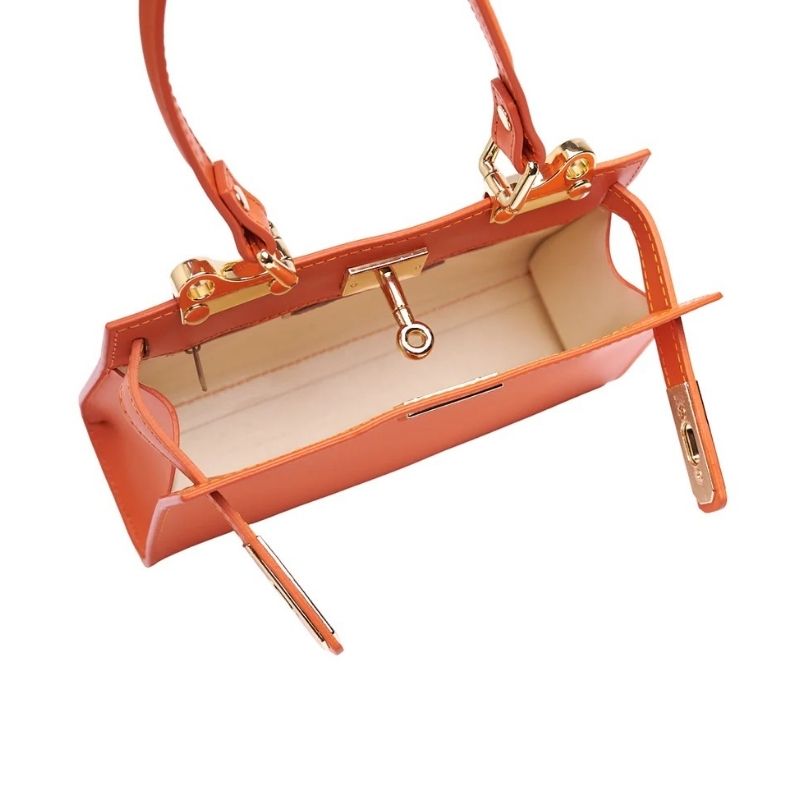 Close-up of the secure twist-lock on the Georgia Orange bag by Numabagstore