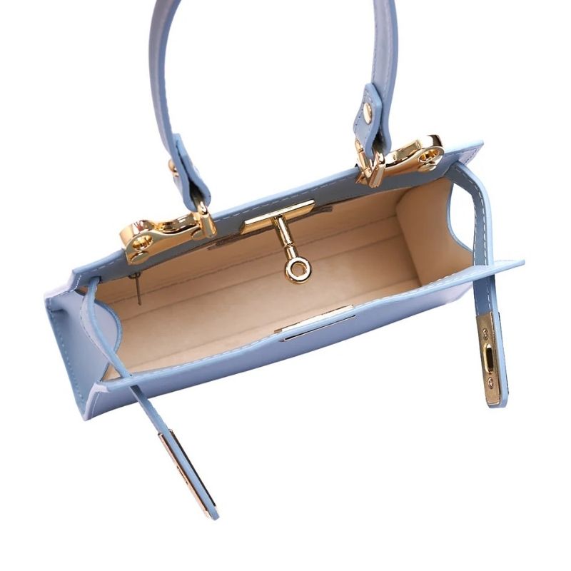 Close-up view of Numabagstore's Georgia Spring, showcasing the secure twist-lock and gold hardware