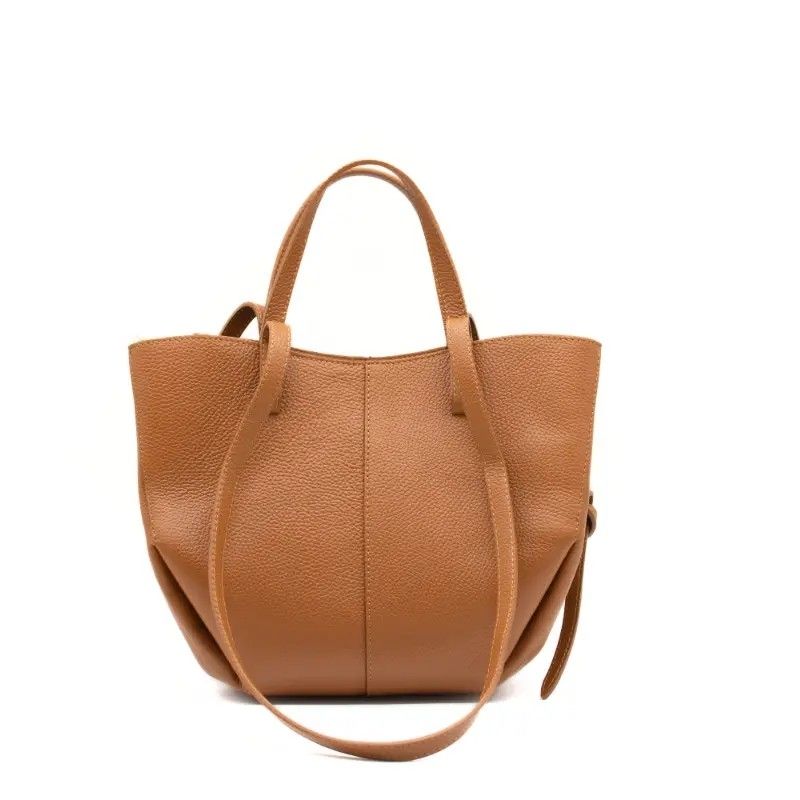 Modern and stylish Numabagstore's Stefania Camel leather shoulder bag in an everyday setting